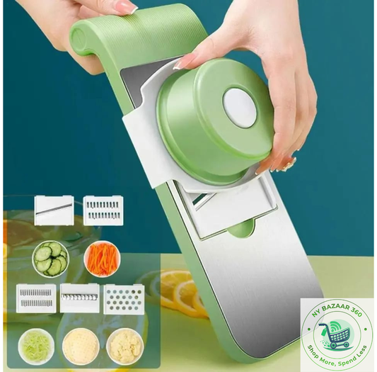 Green and white vegetable chopper with attachments on a green background